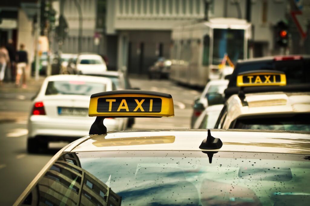 a taxi sign on top of a car